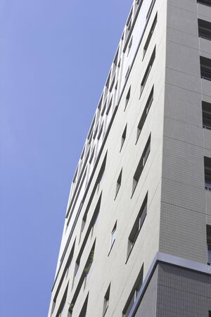 Exterior wall of the apartment building and blue sky