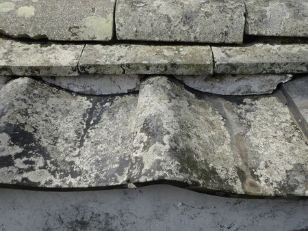 Dilapidated roof tilesの写真素材