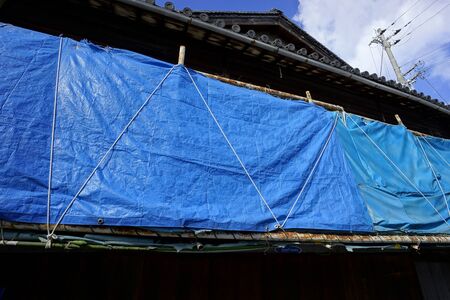 Deserted house blue sheet の写真素材