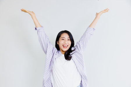 Asian woman with cheering poseの写真素材