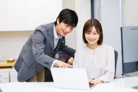 Young adults having discussion about workの写真素材