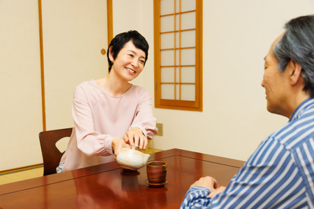 Mature Japanese couple having their tea timeの写真素材
