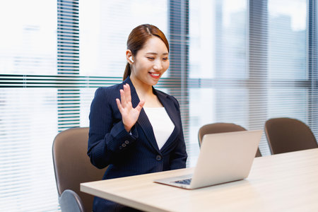 Asian businesswoman videoconferencing in the officeの写真素材