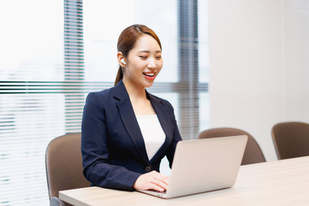 Asian businesswoman videoconferencing in the officeの写真素材