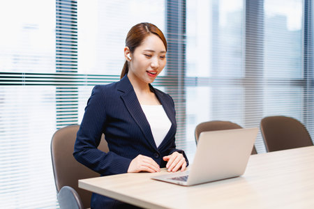 Asian businesswoman videoconferencing in the officeの写真素材