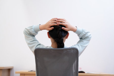 Asian girl feeling stressed while studyingの写真素材