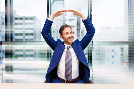 Caucasian man in formal wear with Yes gestureの写真素材