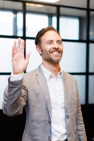 Caucasian businessman in smart casual attire at workplaceの写真素材