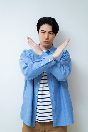 Japanese man showing No gesture