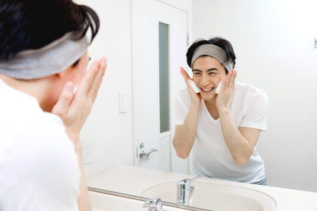 Japanese man washing his faceの写真素材