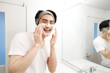 Japanese man washing his faceの写真素材