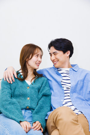 Lovely Japanese couple looking at each otherの写真素材