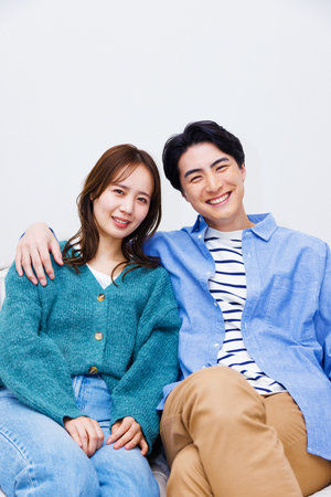 Japanese couple smiling at the cameraの写真素材