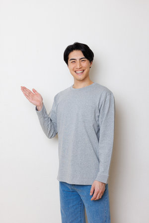 Japanese man showing hand gestureの写真素材