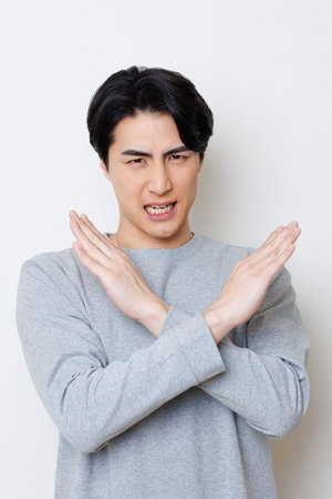 Japanese man showing No gestureの写真素材