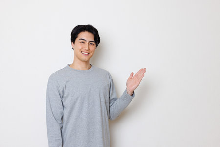 Japanese man showing hand gestureの写真素材