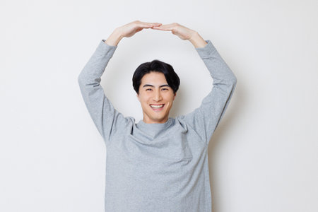 Japanese man with Yes gestureの写真素材