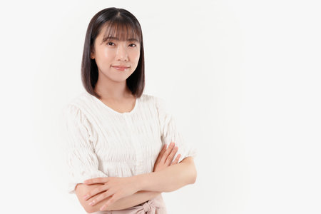 Japanese woman with crossed arms poseの写真素材