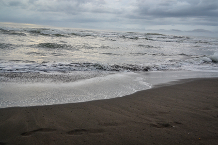 beach with dark sandの写真素材