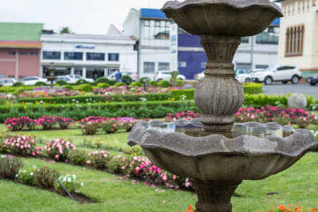 a fountain in the middle of the gardenの写真素材