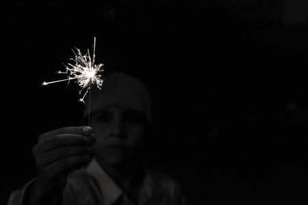 boy playing with sparklersの写真素材