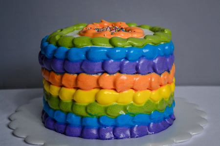 birthday cake with the colors of the rainbowの写真素材