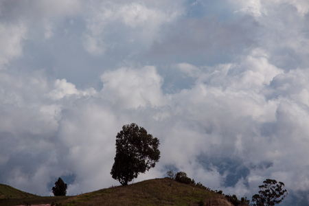 Back light of the hill with a cloudy skyの写真素材