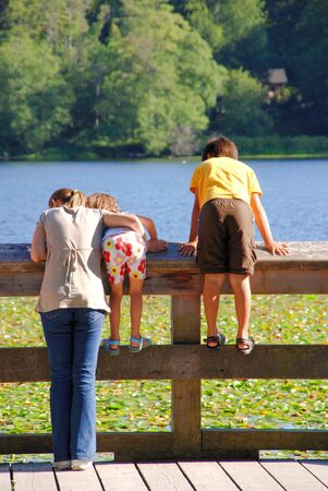 A happy family having fun at the Deer Lake, Canadaの写真素材