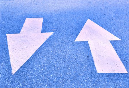 Road direction sign with blue toneの写真素材