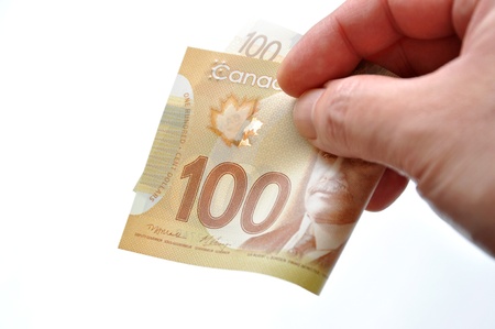 Handing new one hundred bill on white background