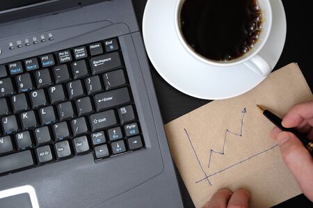 Man drawing business finance graphsの写真素材