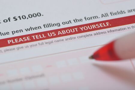 Man holding pen to fill in the application formの写真素材