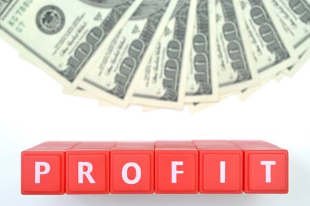 Red profit word and one hundred us dollar backgroundの写真素材