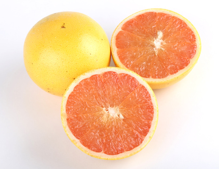 Ripe grapefruit and half isolated on white の写真素材
