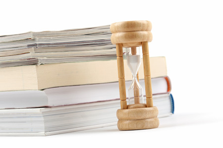 Hourglasses and book isolated on white background 