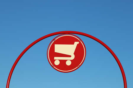 Shopping cart sign against blue skyの写真素材