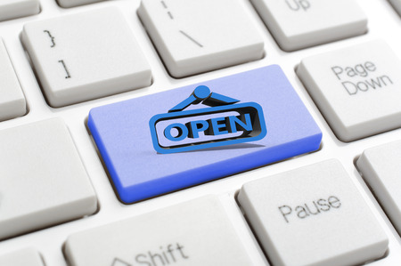 Blue open sign on keyboard