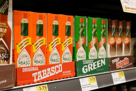 New Westminster, BC, Canada - April 15, 2017 : Close up display Tabasco red and green pepper sauce inside buy low foods storeのeditorial素材