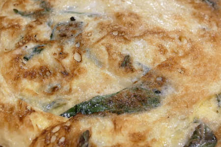 Close up fried Egg with Chinese Basil on dish inside Chinese restaurantの写真素材