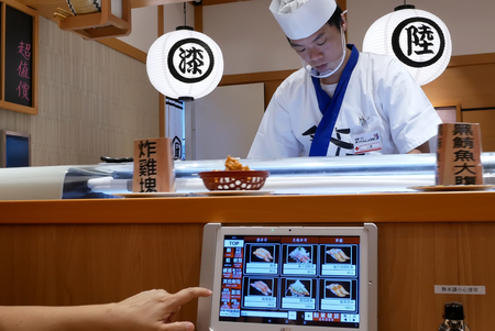 Taipei, Taiwan - August 25, 2018 : Motion of people ordering food at ipad inside a Japanese restaurantのeditorial素材
