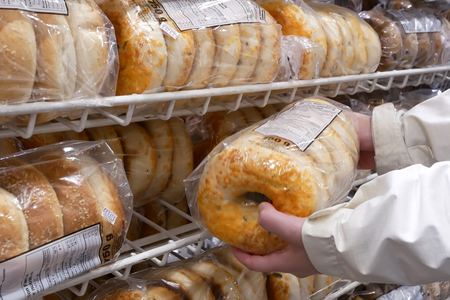 Close up of people buying bagel inside Costco store