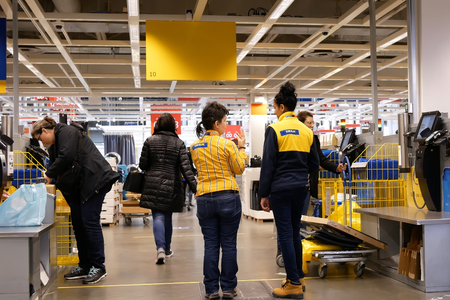 Coquitlam, BC, Canada - February 01, 2019 : Motion of people paying product at self check out counter inside Ikea store in Coquitlam BC Canadaのeditorial素材