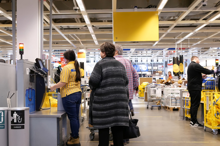 Coquitlam, BC, Canada - February 01, 2019 : Motion of people paying product at self check out counter inside Ikea store in Coquitlam BC Canadaのeditorial素材