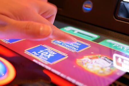 Coquitlam, BC, Canada - May 31, 2019 : Motion of people playing slot machine inside Casino