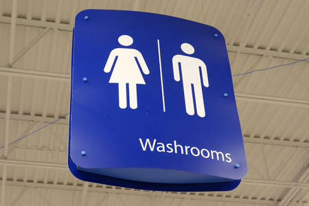 Motion of man and woman washroom hanging up the roofの写真素材