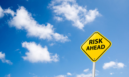 risk ahead sign on skyの写真素材