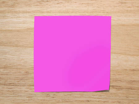 pink  paper note on Texture of wood background closeupの写真素材