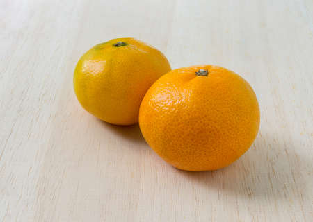 Orange on the white wood