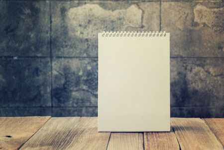 Blank desktop calendar on vintage old wood table