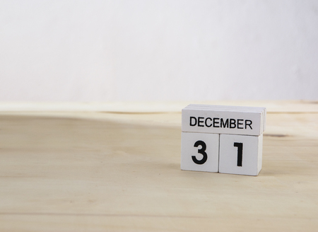 31 December wooden cube calendar on wood surface with copy spaceの写真素材